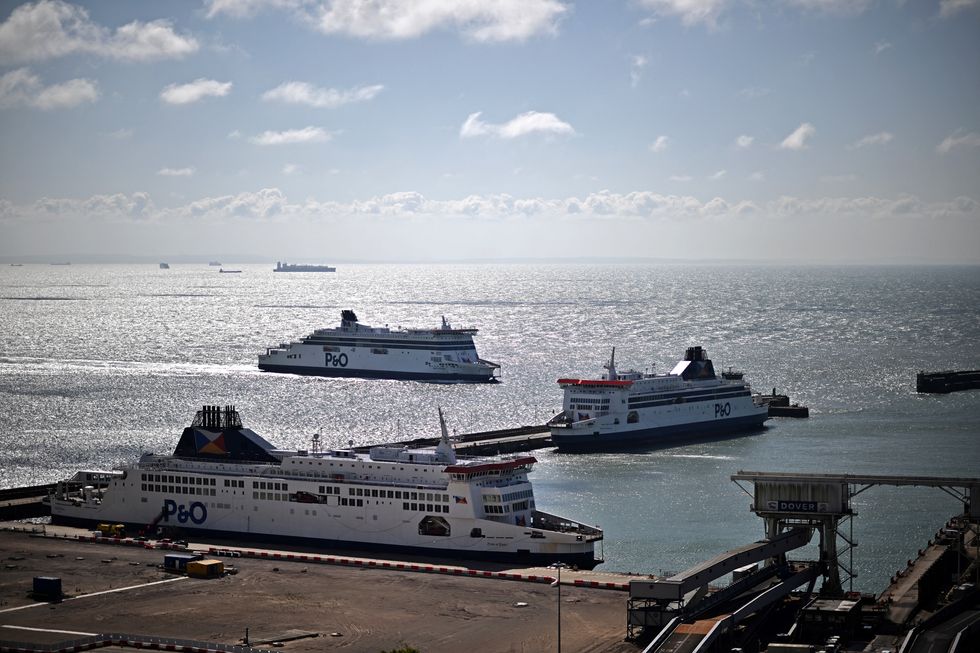 The P&O ferry 'Spirit of Britain' (L) passes the 'Pride of Canterbury' as it sails back into the Port of Dover after undergoing sea trials