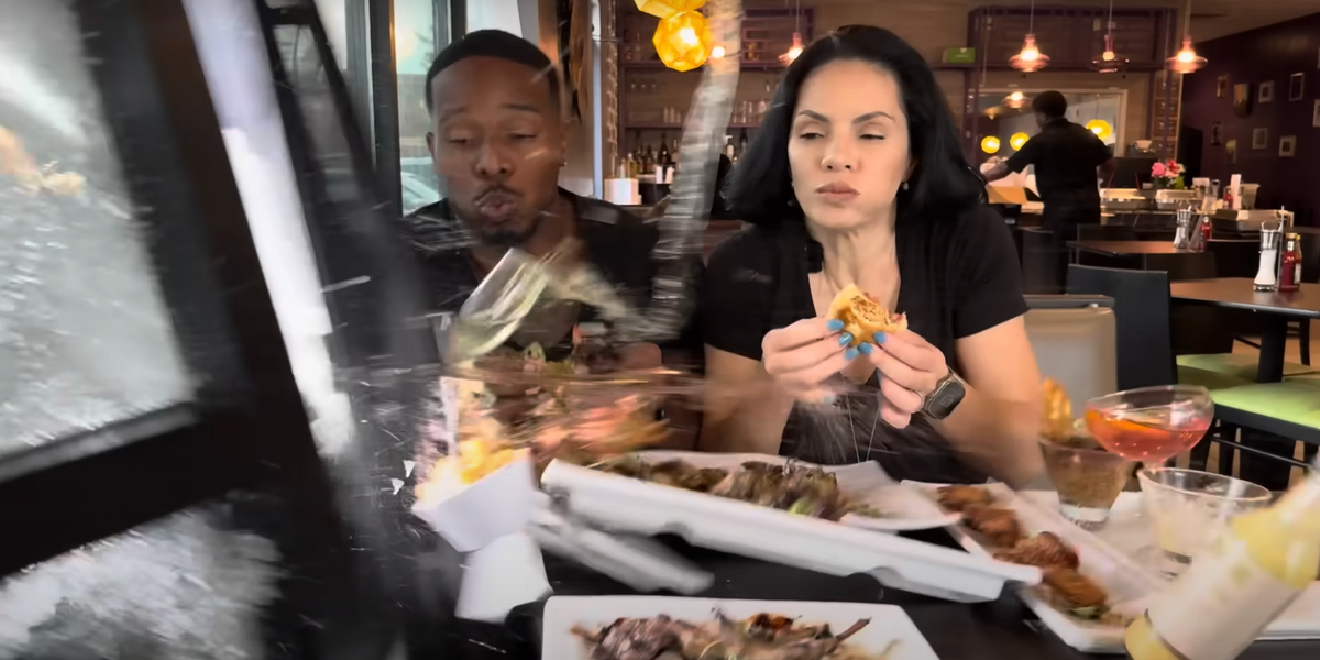 NextImg:Food influencers hit by car while recording burger review in restaurant