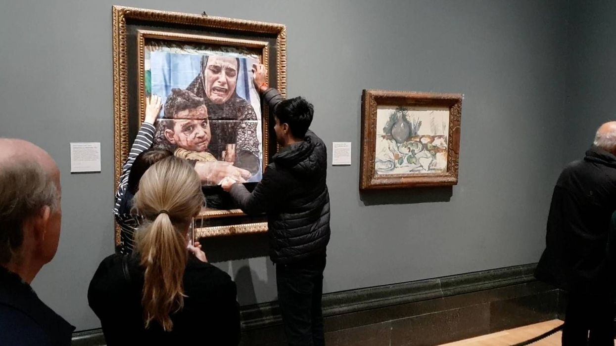 The pair pasted the picture over the artwork