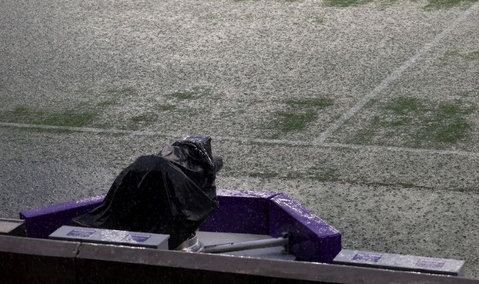 The pitch has been left completely flooded with the friendly match at risk of being called off