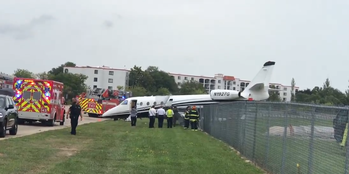 NextImg:Travel chaos as plane crashes through fence at Chicago airport