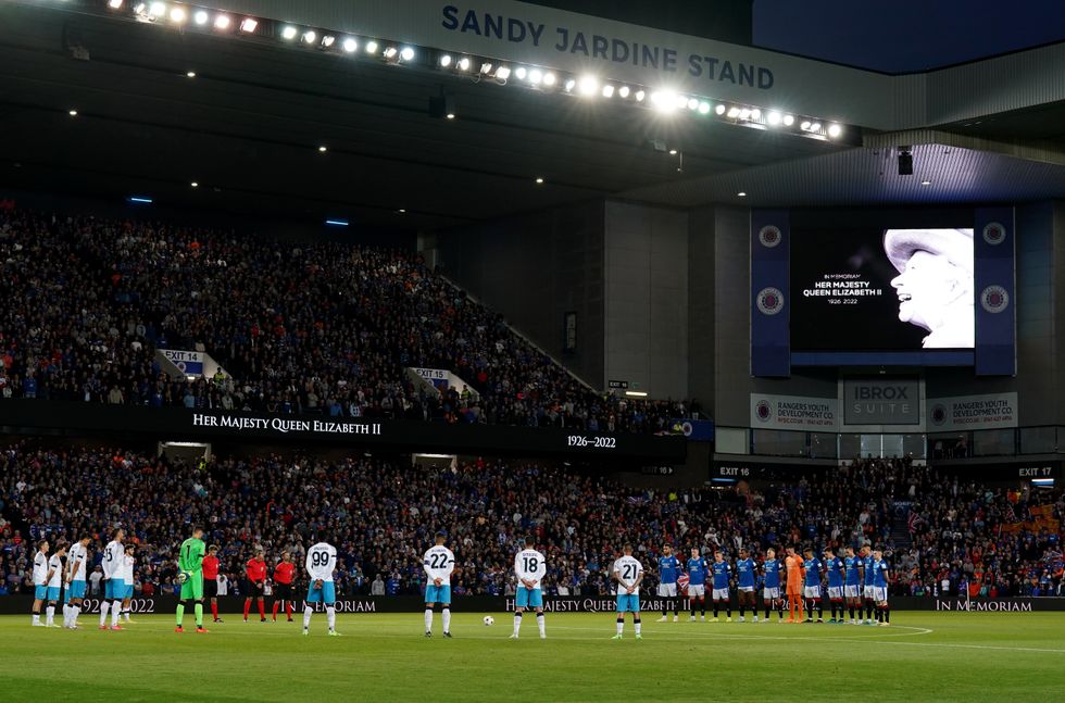 The players stand for a minute's silence at Ibrox Stadium, Glasgow, ahead of the UEFA Champions League Group A match, following the death of Queen Elizabeth II on Thursday September 8, 2022. Picture date: Wednesday September 14, 2022.