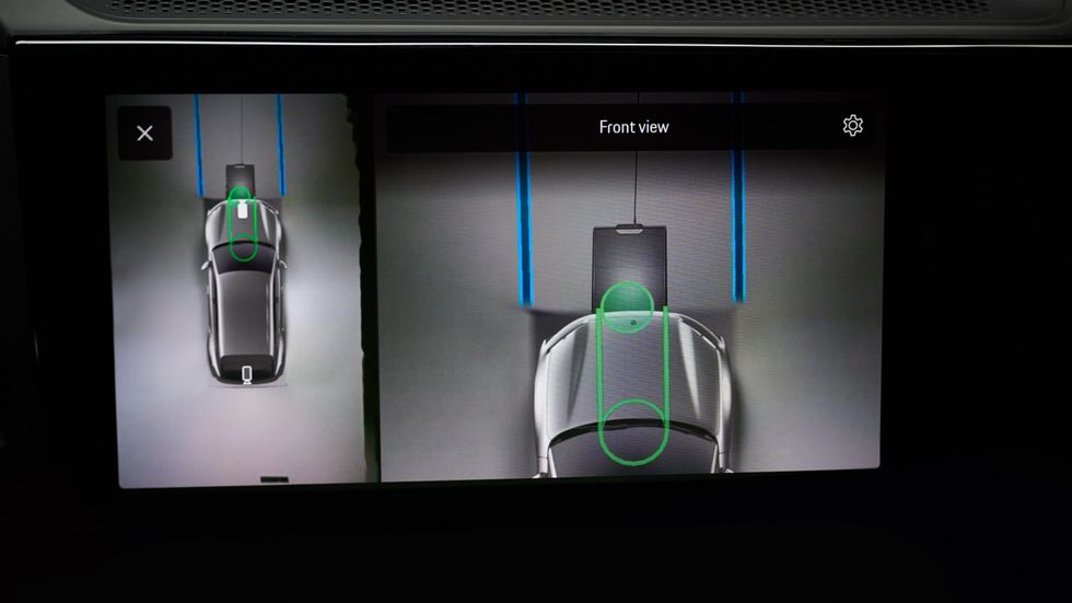 The Porsche Cayenne Electric with the wireless charging pad