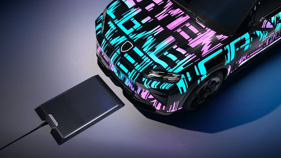 The Porsche Cayenne Electric with the wireless charging pad