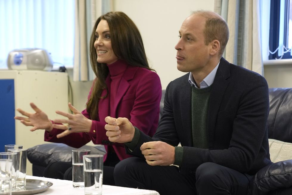 The Prince and Princess of Wales speak to members of staff during a visit to Windsor Foodshare in Windsor, Berkshire, to hear about the support that the organisation provides to individuals and families living in the local area, and helping volunteers to sort food donations and prepare packages for the charity's clients to collect later that day. Picture date: Thursday January 26, 2023.