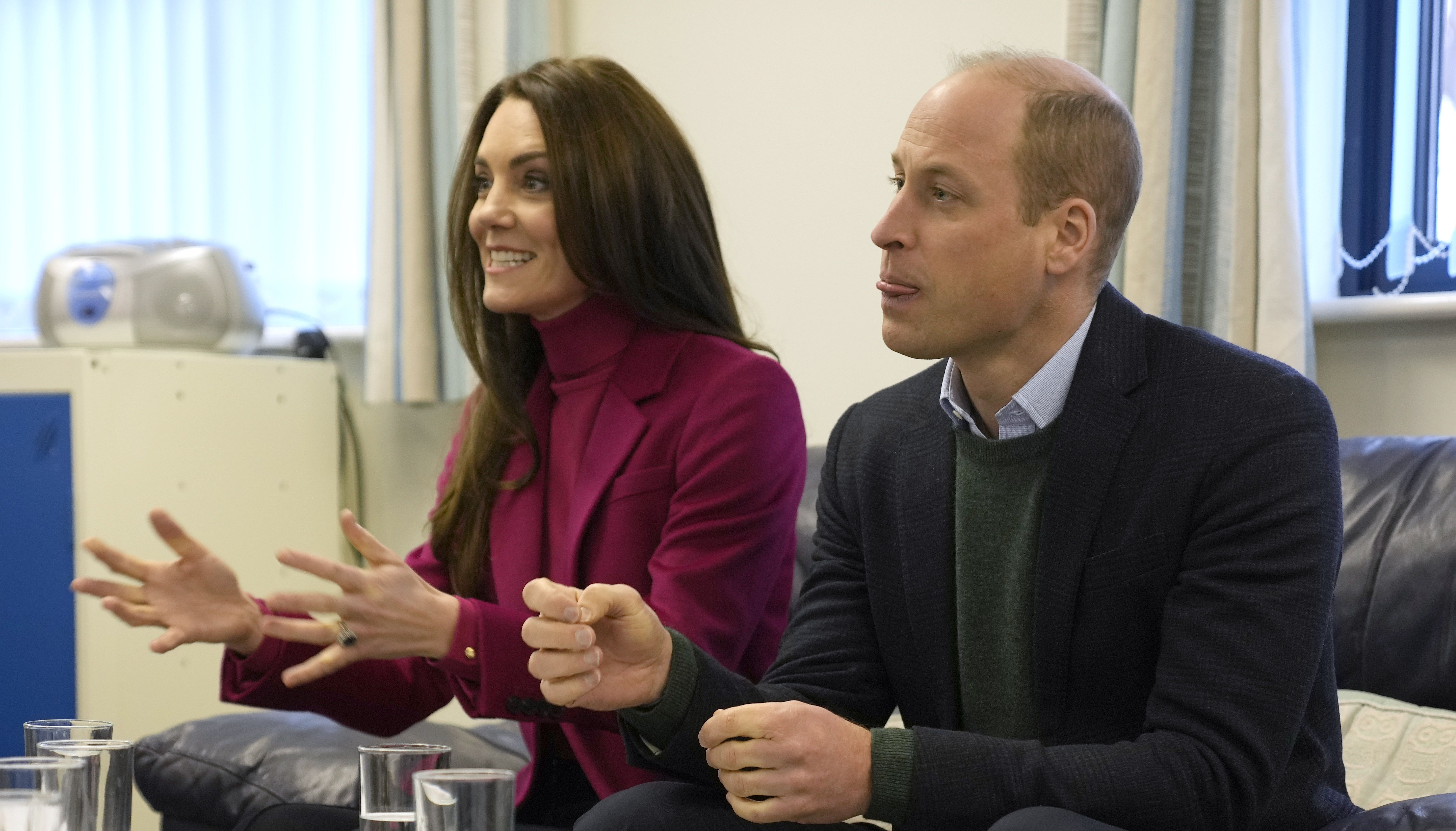 The Prince and Princess of Wales speak to members of staff during a visit to Windsor Foodshare in Windsor, Berkshire, to hear about the support that the organisation provides to individuals and families living in the local area, and helping volunteers to sort food donations and prepare packages for the charity's clients to collect later that day. Picture date: Thursday January 26, 2023.