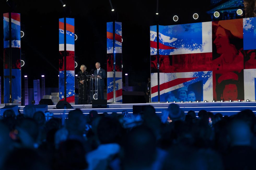 The Prince of Wales accompanied by the Duchess of Cornwall speaks at the Platinum Party at the Palace in front of Buckingham Palace, London