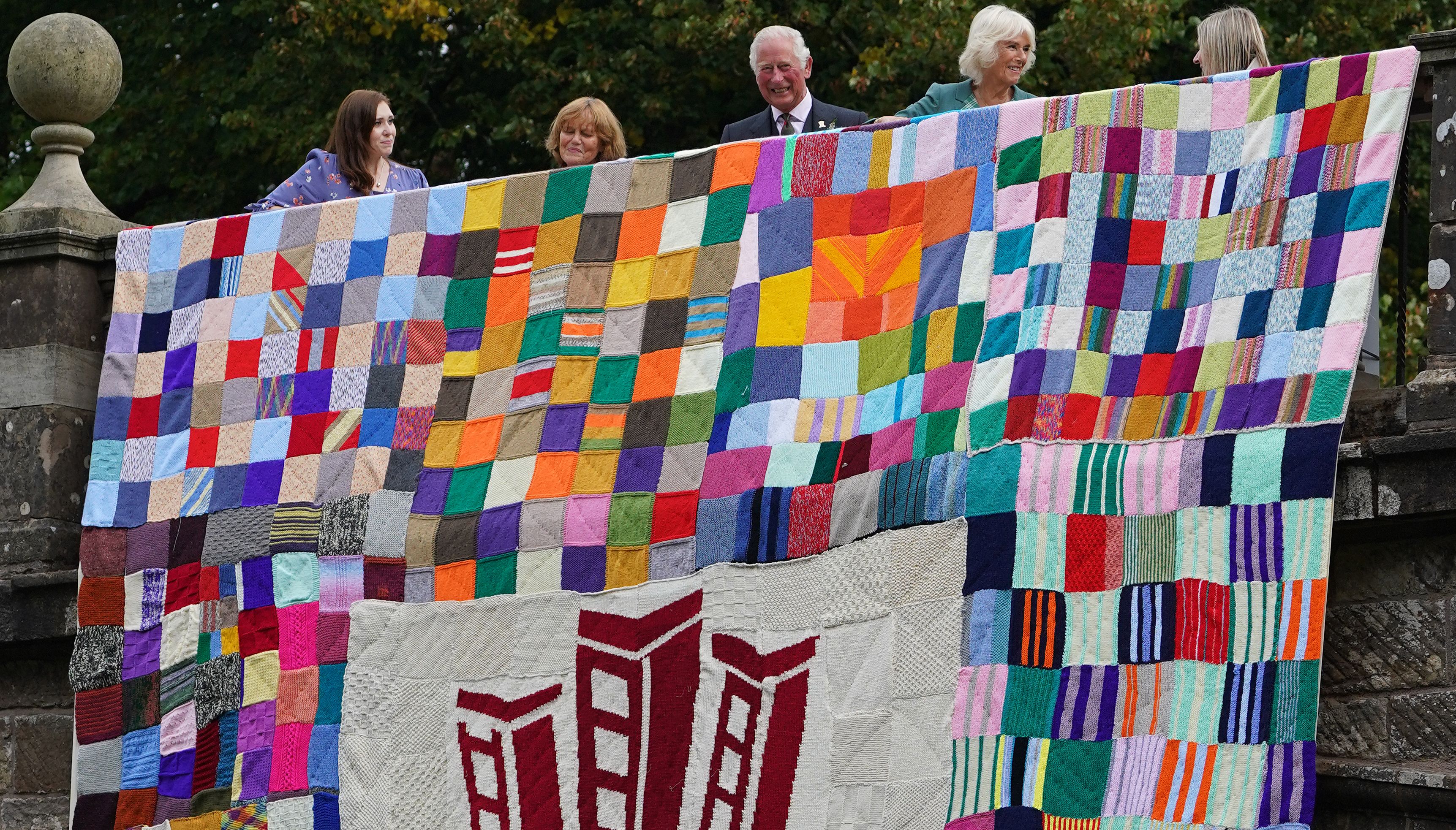 The Prince of Wales and the Duchess of Cornwall unveil a knitted art installation during a visit to Dumfries House in Ayrshire, in celebration of the Prince's Foundation achieving its aim to get the world knitting.