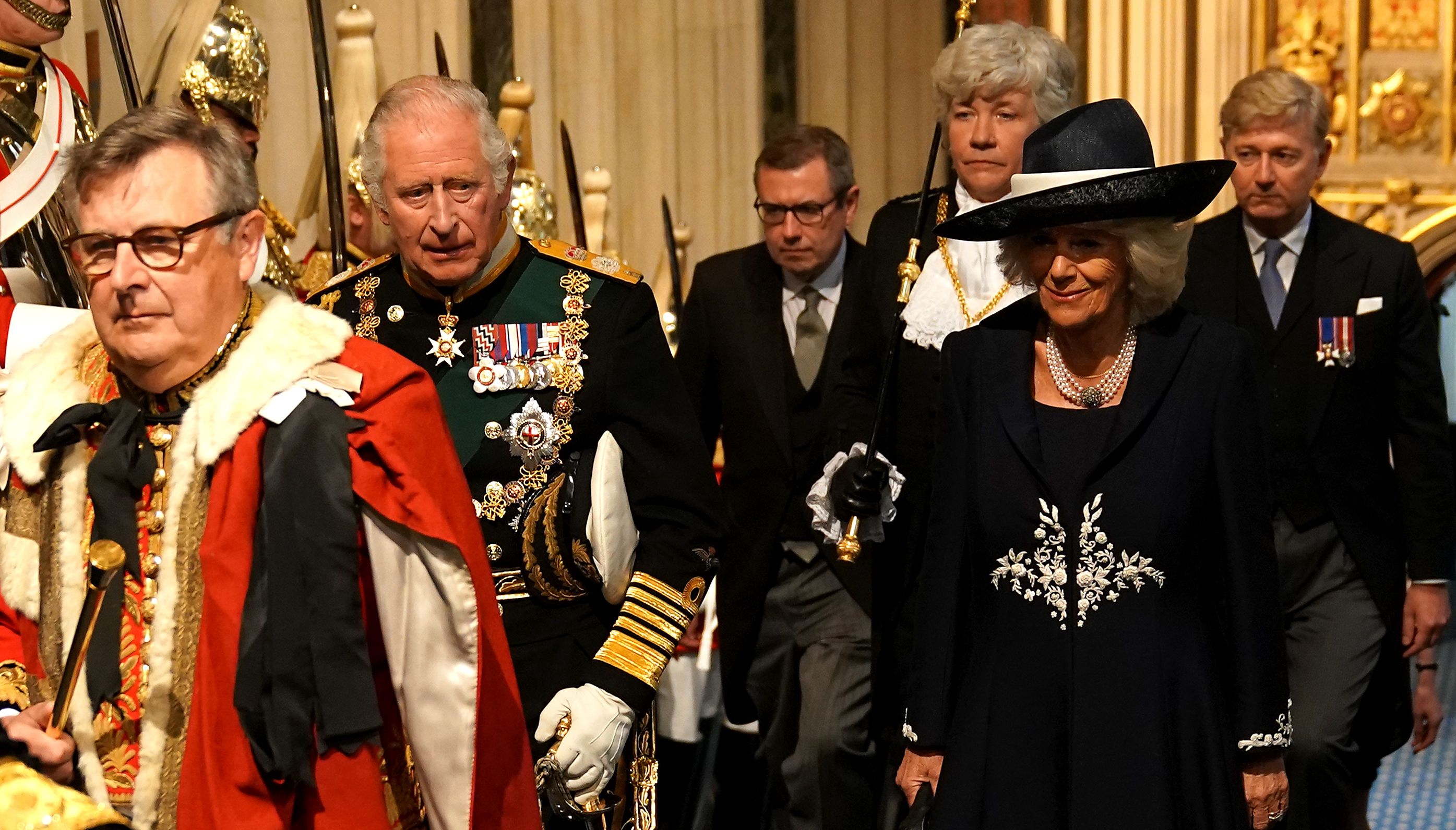 The Prince of Wales and the Duke of Cambridge walks past the The Household Cavalry at the Palace of Westminster ahead of the State Opening of Parliament.