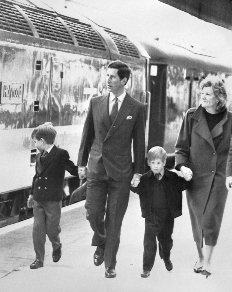 The Prince of Wales arrives at Aberdeen rail station on his way to the Royal Family's retreat at Balmoral. He took his two sons, six-year-old Prince William, left, and four-year-old Prince Harry, accompanied by their nanny Ruth Wallace.