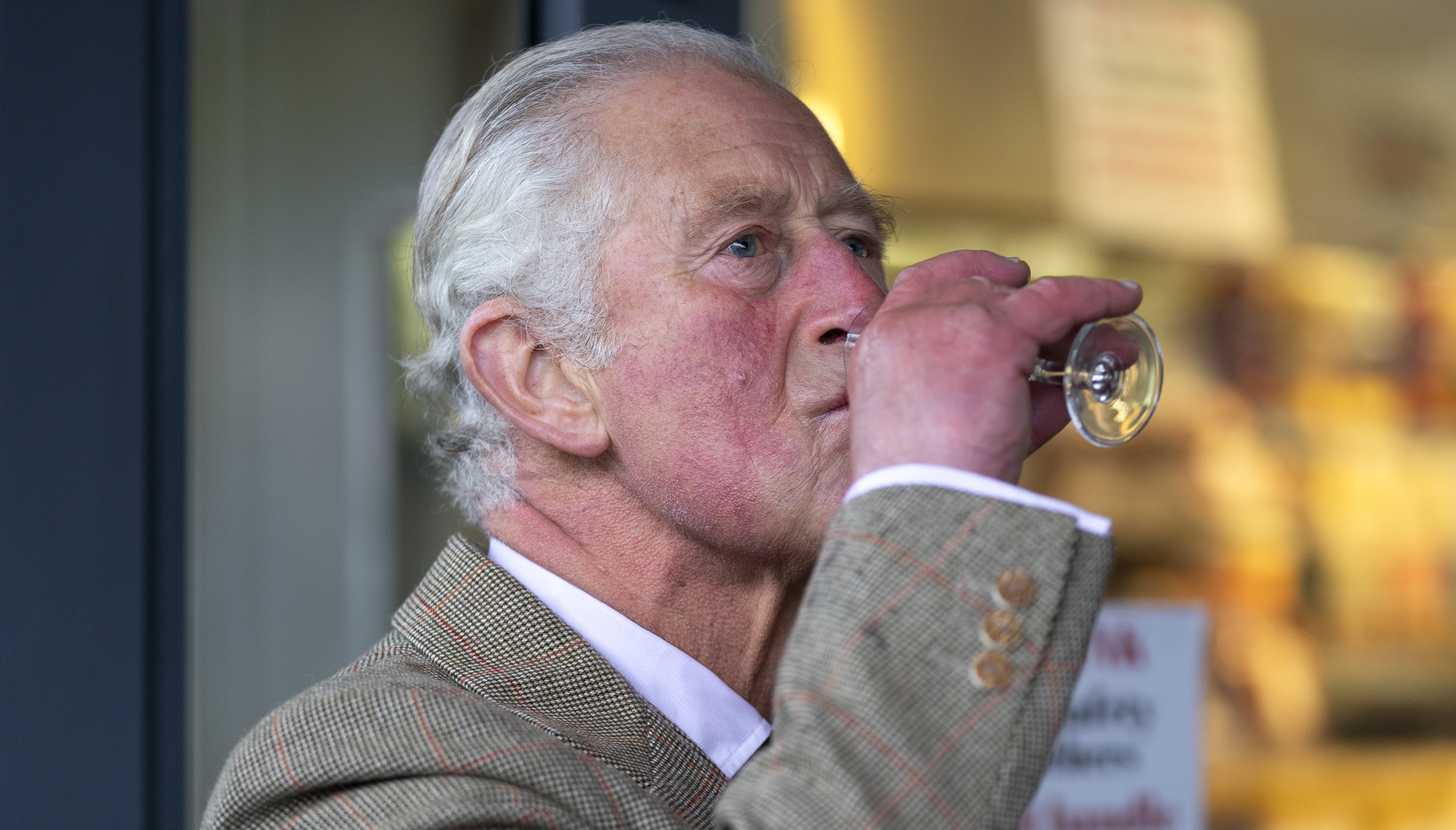 The Prince of Wales, known as the Duke of Rothesay when in Scotland, tastes a dram of Culdrain Octave whisky at Davidson's Butchers shop during a visit to Inverurie Farmers Market and local shops around the town centre in Inverurie, Aberdeenshire.