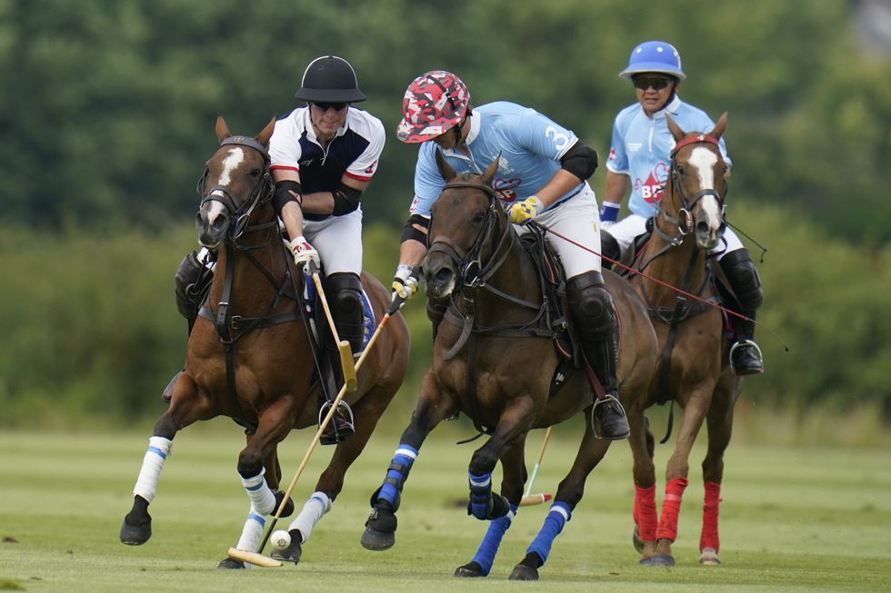 The Prince of Wales (left) during the Out-Sourcing Inc Royal Charity Polo Cup 2023 at Guards Polo Club