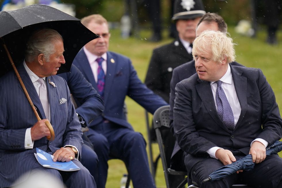 The Prince of Wales (left) greets Prime Minister Boris Johnson at the unveiling of the UK Police Memorial at the National Memorial Arboretum at Alrewas, Staffordshire.