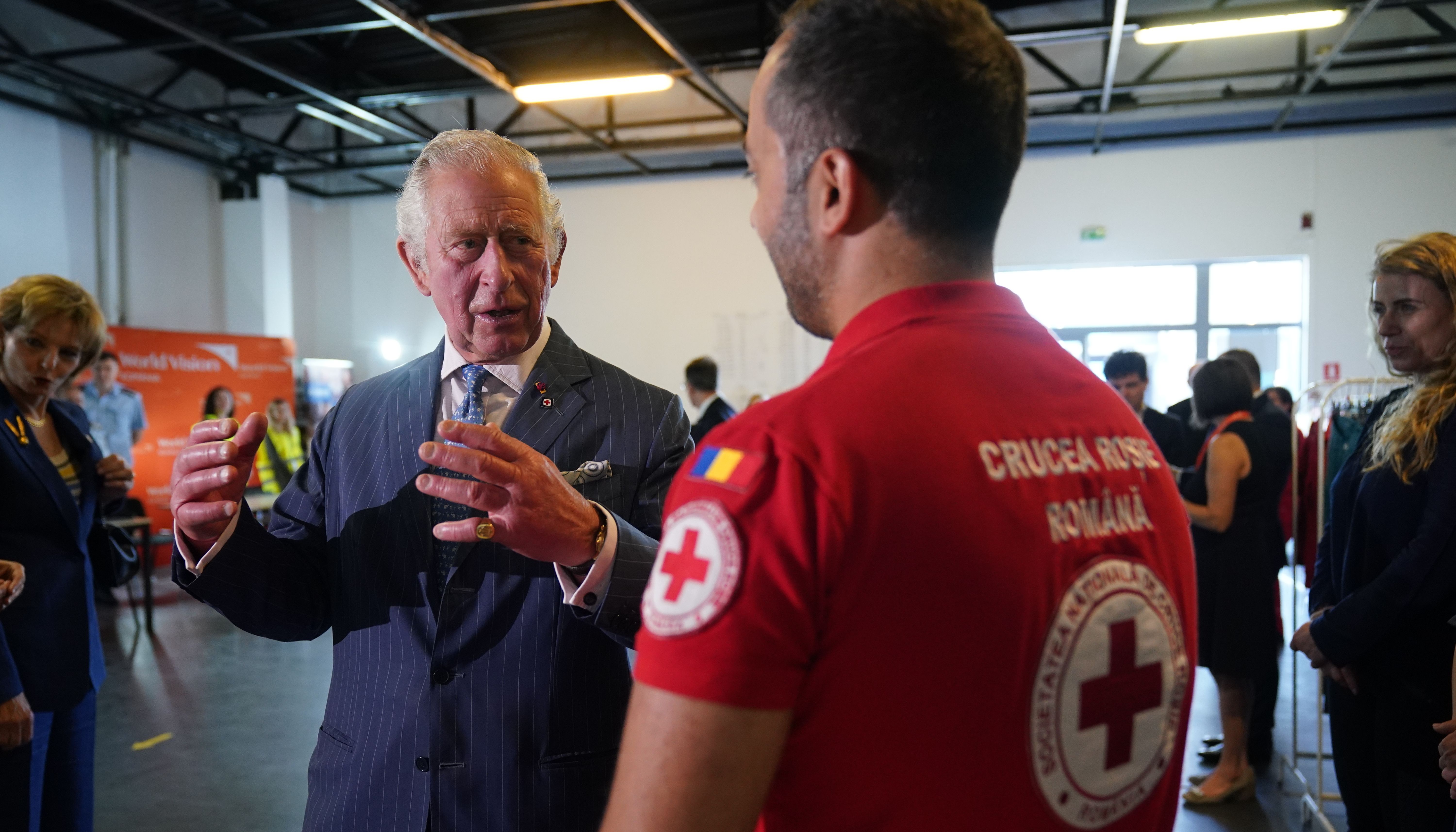 The Prince of Wales meets with members of the Red Cross during his visit to the Ukrainian refugee centre in Bucharest, Romania. Picture date: Wednesday May 25, 2022.