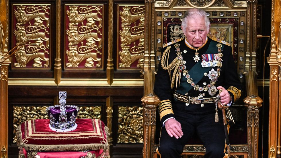 The Prince of Wales sits by the Imperial State Crown.