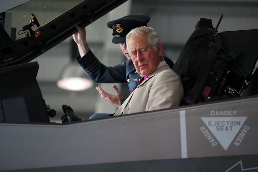 The Prince of Wales sits in an F-35 during a visit to 617 Squadron at RAF Marham in Kings Lynn, Norfolk