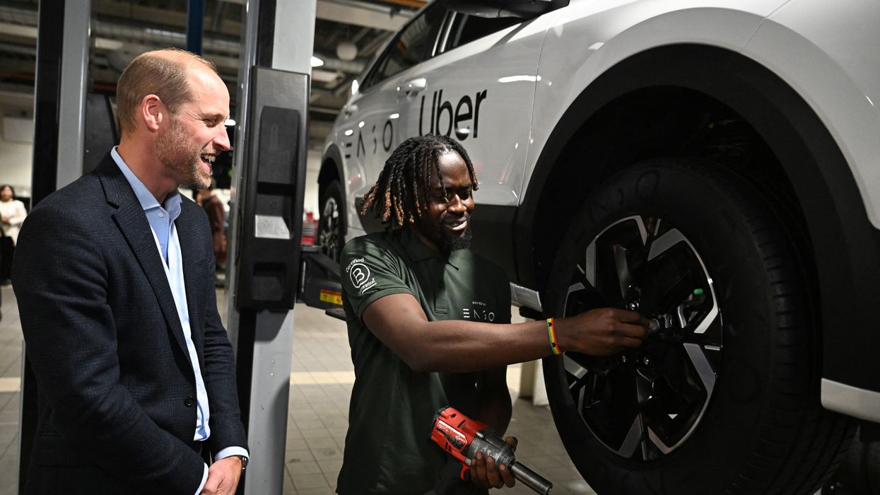 The Prince of Wales speaking to a worker during a visit to the 2023 Earthshot Prize Finalist, ENSO, in Brentford