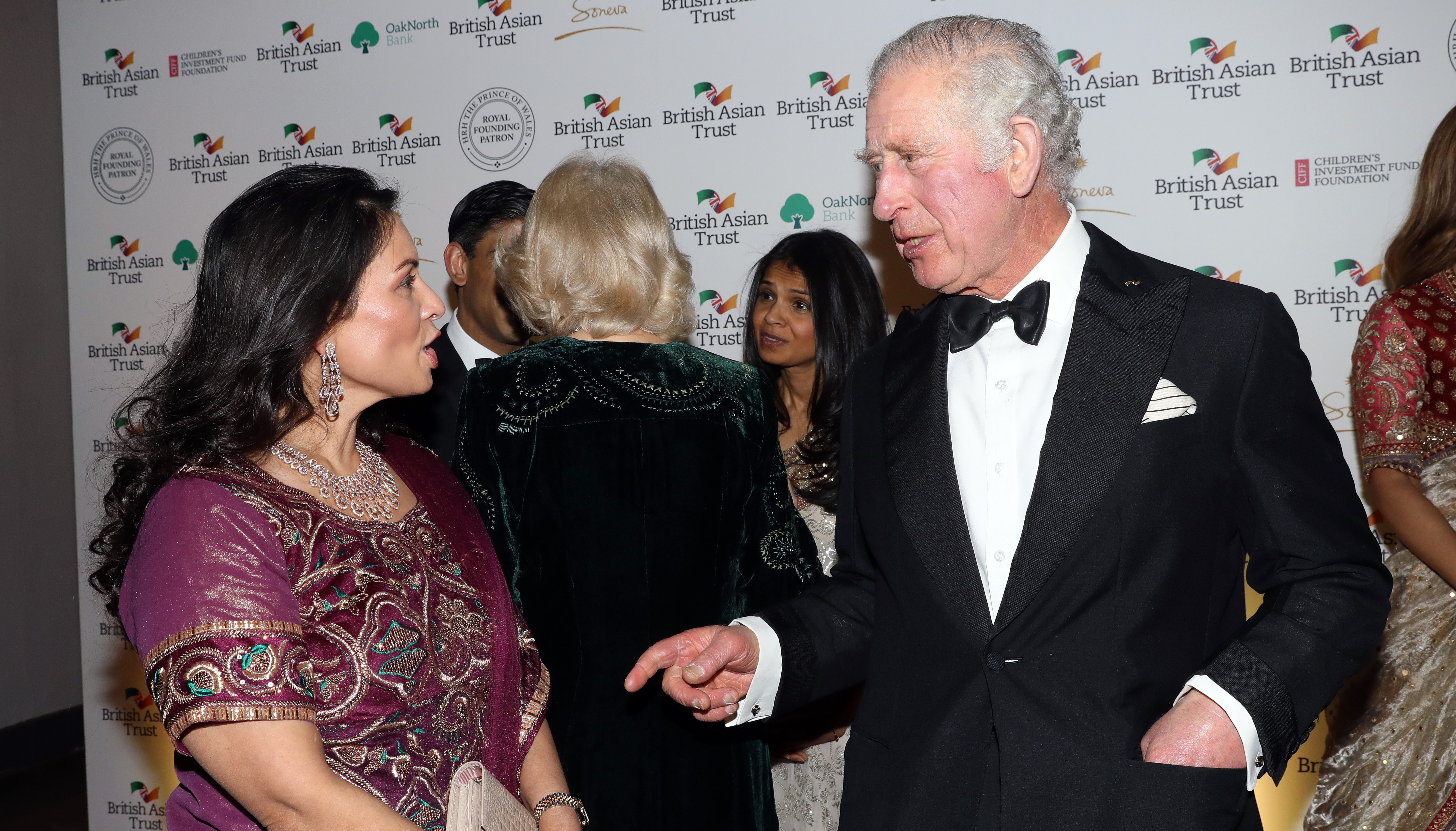 The Prince of Wales speaks to Home Secretary Priti Patel as they attend a reception to celebrate the British Asian Trust at the British Museum.
