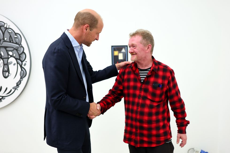 The Prince of Wales speaks with Dave Martin during a visit to the Saatchi Gallery