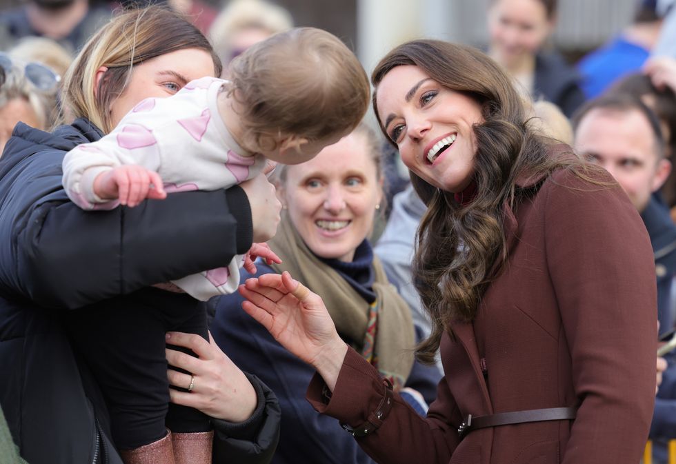 The Princess of Wales, known as the Duchess of Cornwall while in Cornwall, interacts with a child as she departs the National Maritime Museum Cornwall in Falmouth, following a tour to learn more about the rich maritime heritage of Cornwall and how the museum is working to highlight the relevance of maritime issues to the present day. Picture date: Thursday February 9, 2023.