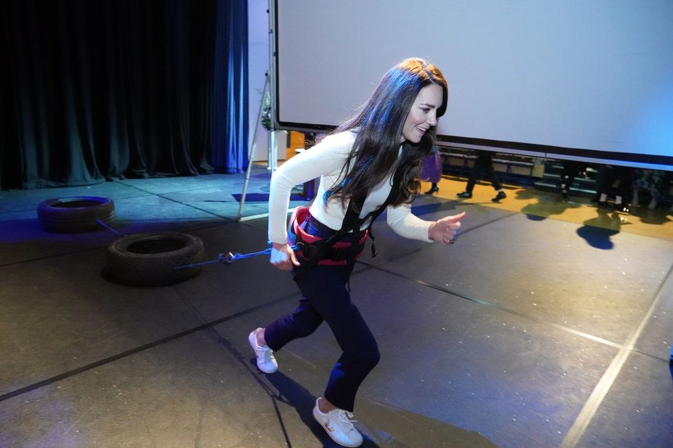 The Princess of Wales, pull tyres behind her, during a visit to Landau Forte College, in Derby, to celebrate Captain Preet Chandi's return from her solo expedition across Antarctica. Picture date: Wednesday February 8, 2023.