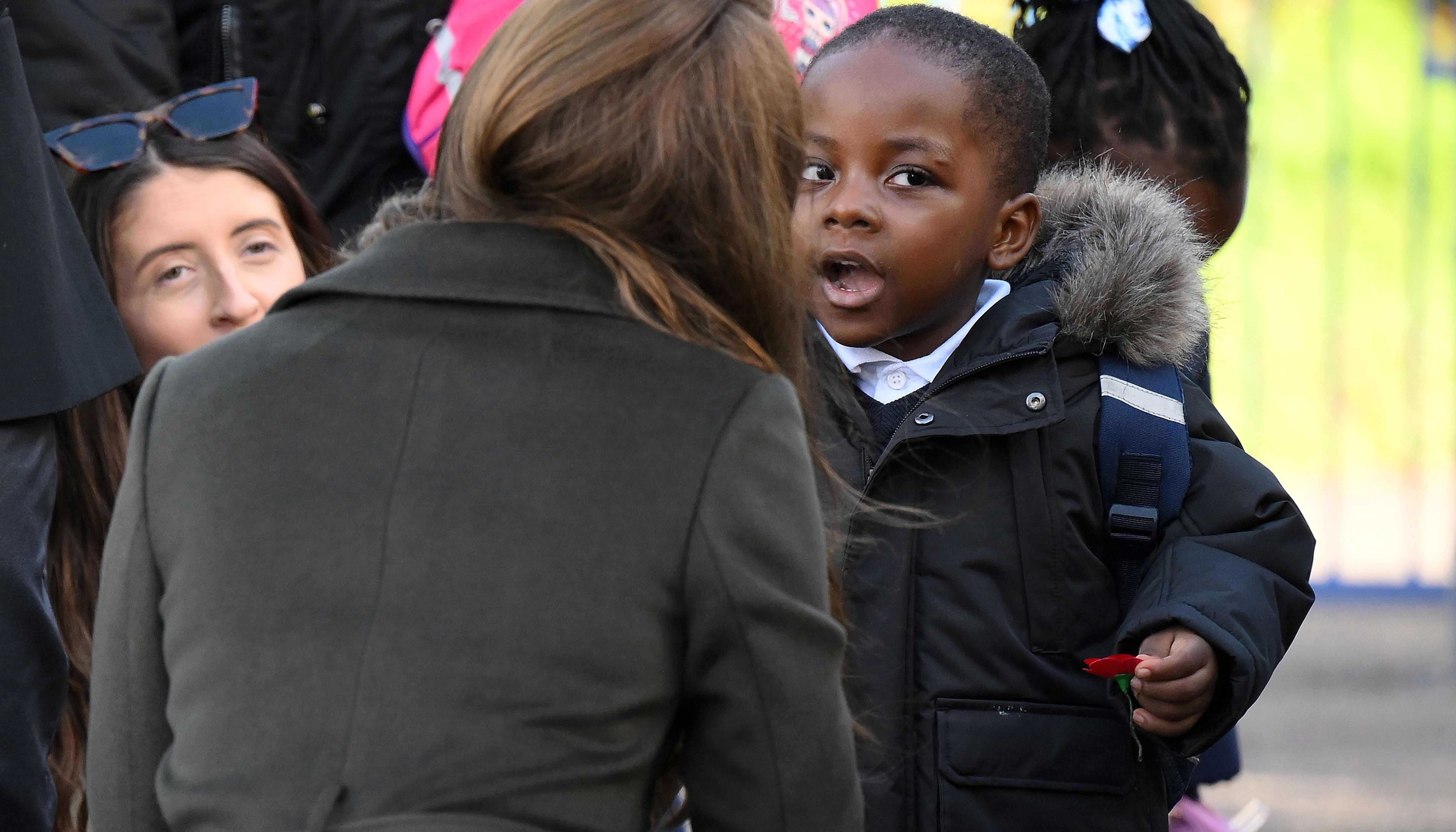 The Princess of Wales speaks with a young child as she leaves after a visit to Colham Manor Children's Centre in Hillingdon in West London.