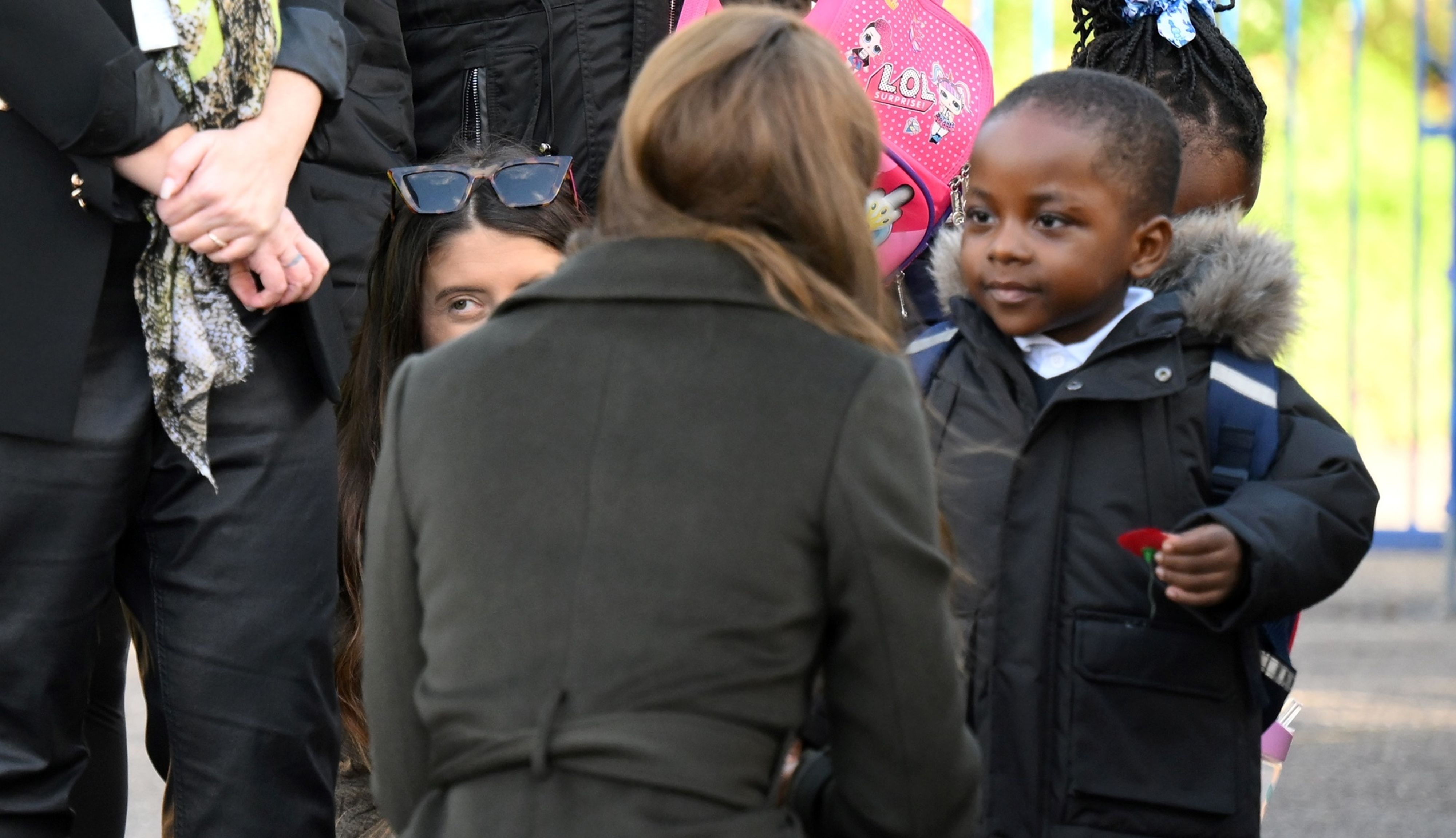 The Princess of Wales speaks with a young child as she leaves after a visit to Colham Manor Children's Centre in Hillingdon in West London.