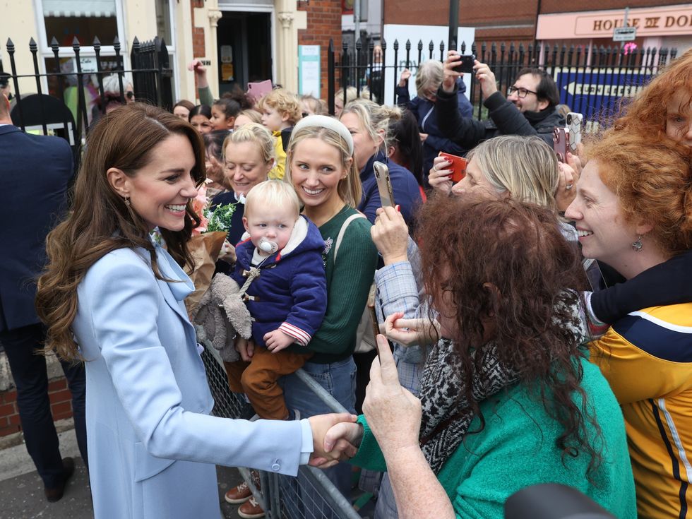 The Princess of Wales was challenged by a woman she shook hands with during a walkabout in Carrickfergus as part of a visit to Northern Ireland.