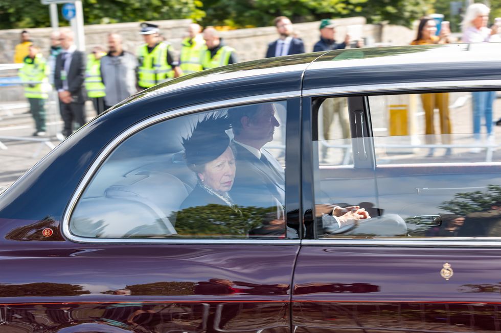The Princess Royal and her husband Admiral Sir Tim Laurence travel behind the hearse carrying the coffin of Queen Elizabeth II, draped with the Royal Standard of Scotland, passing through Aberdeen as it continues its journey to Edinburgh from Balmoral. Picture date: Sunday September 11, 2022.