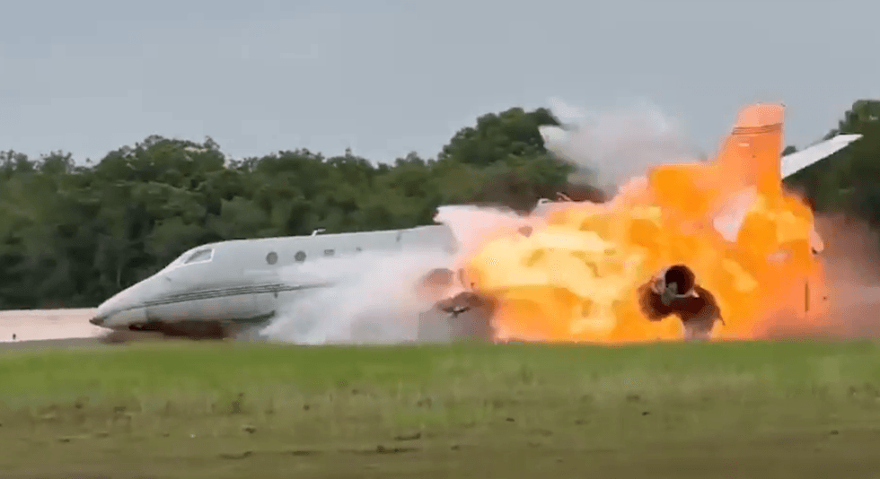 The private jet bursting in flames as it skids along runway