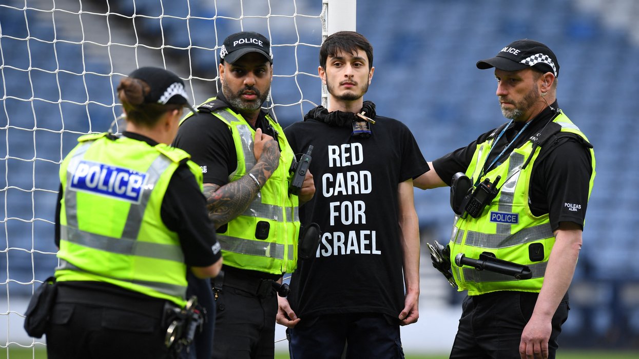 The protester chained themselves to the goal post