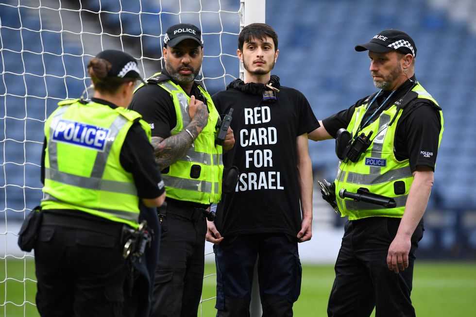 The protester chained themselves to the goal post