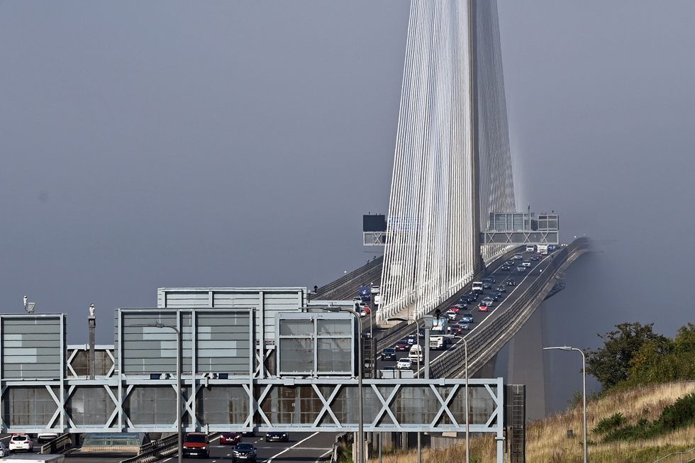 The Queensferry Crossing road bridge disappears into the mist above the Forth Estuary as many parts of Scotland enjoy fine autumn sunshine