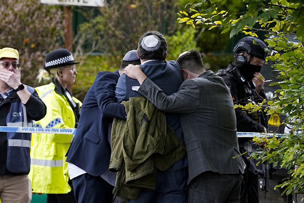 The rabbi shut the doors to the synagogue, preventing the attacker from getting inside