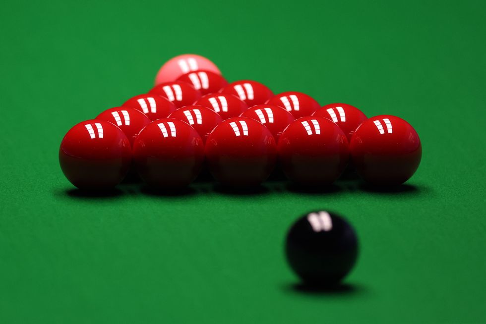 The red balls set up on the table before play during day 1 of the Betfred World Snooker Championships 2021 at The Crucible, Sheffield. Picture date: Sunday April 18, 2021.