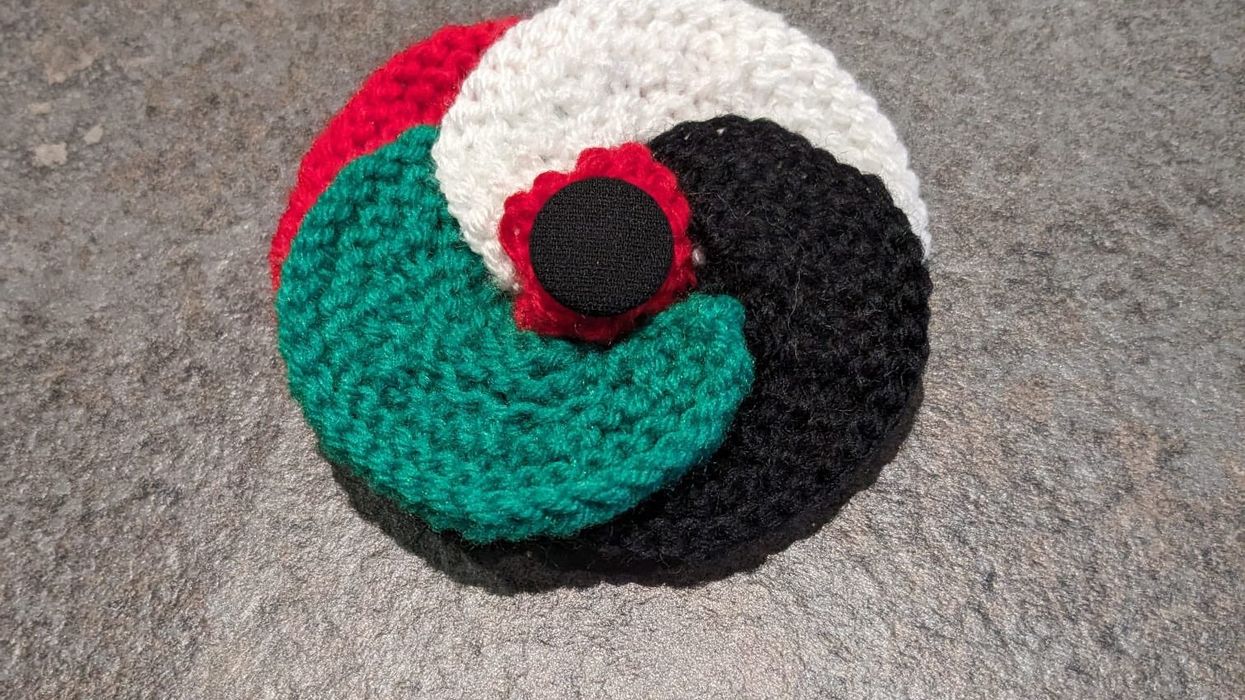 The red, white, green, and black poppy