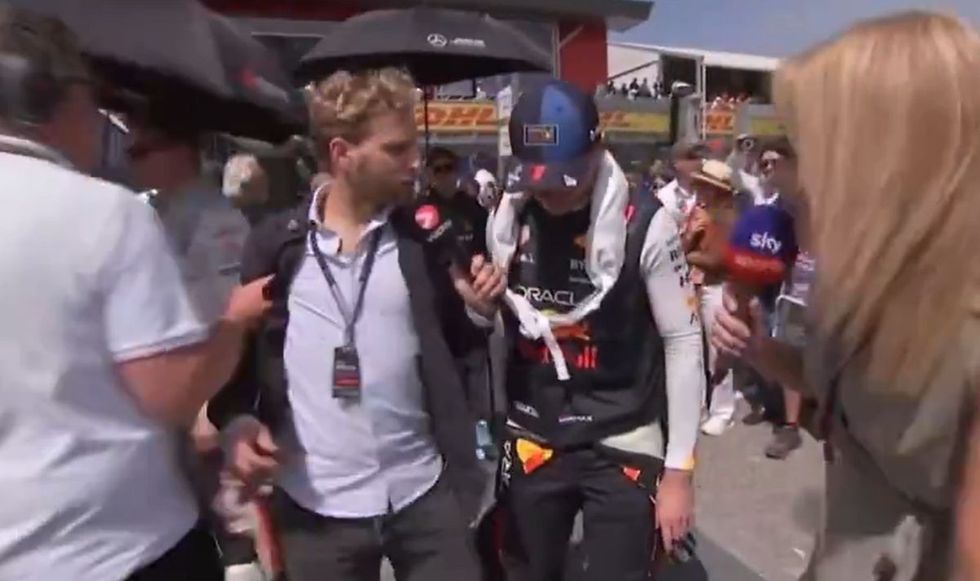 The reporter was talking to Max Verstappen as he walked onto the grid