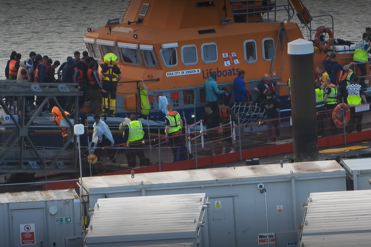 Six people dead and dozens of migrants rescued from Channel waters after small boat capsizes