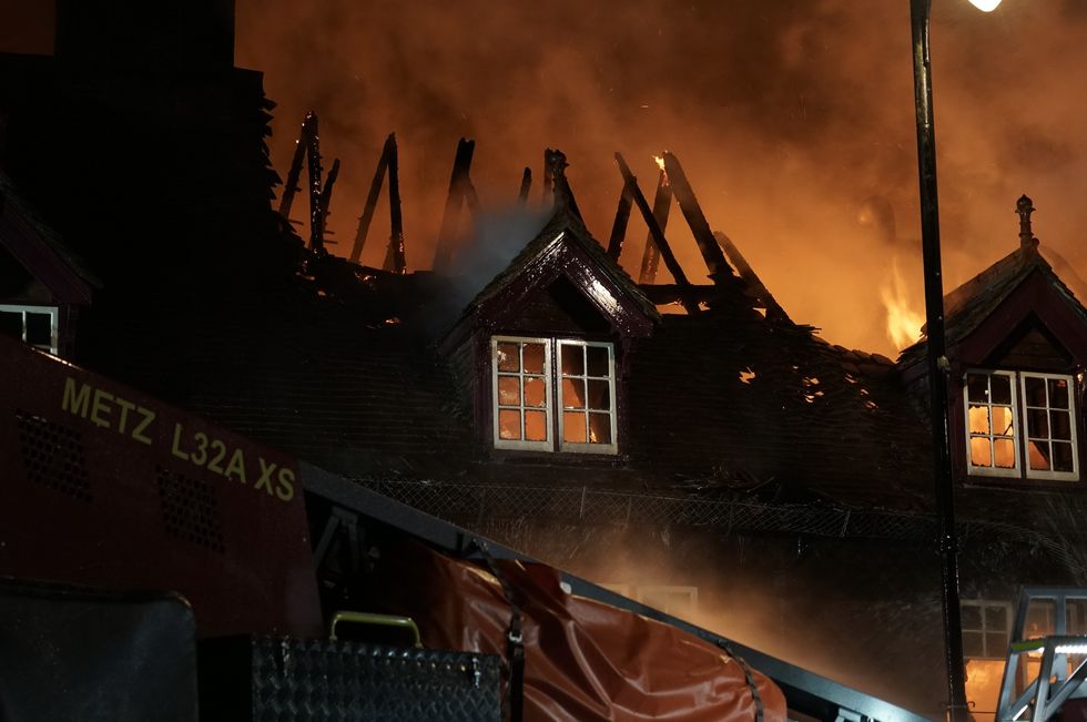 The roof of Angel Inn on fire