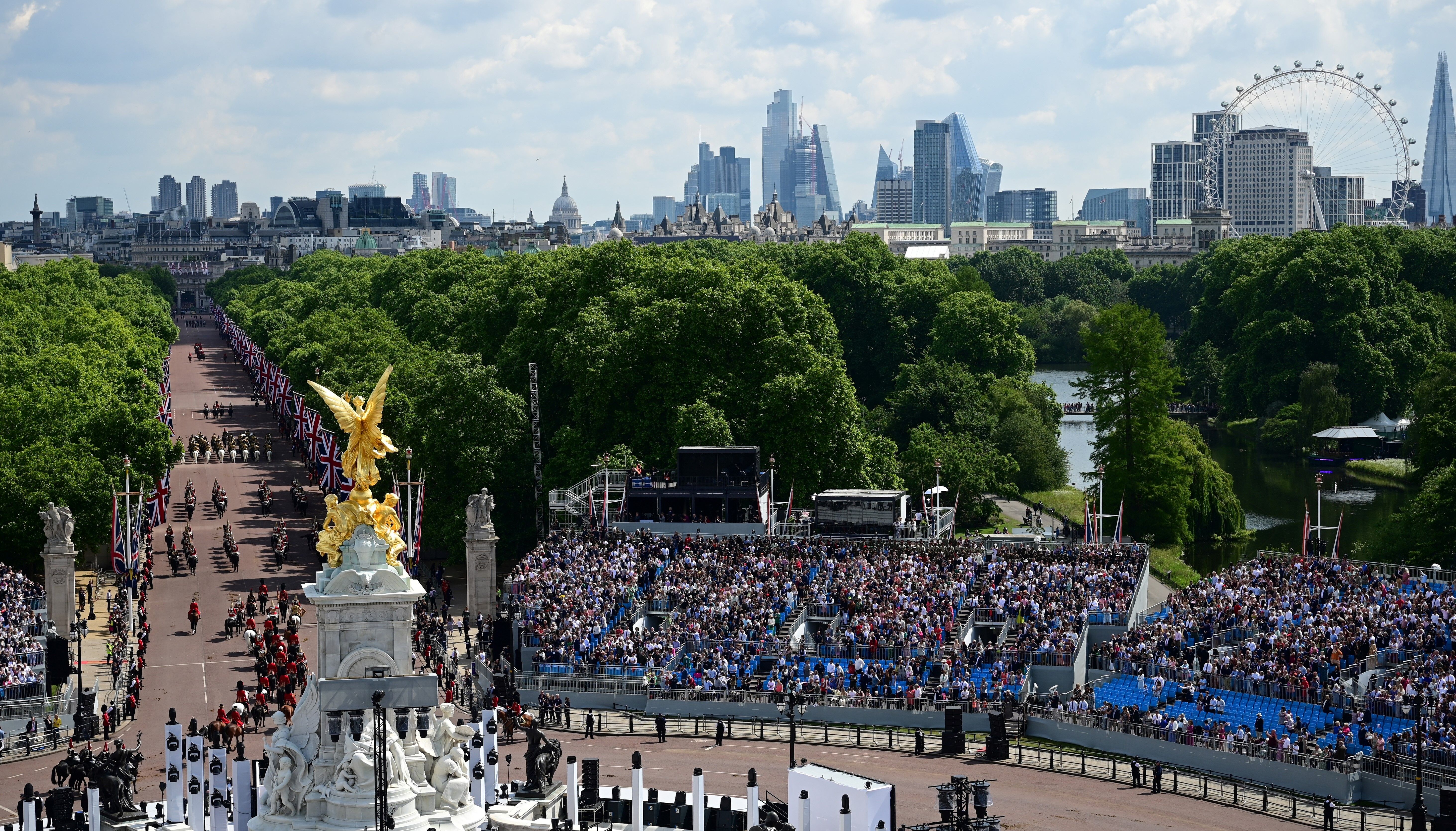 The Royal Procession leaves Buckingham Palace and heads down the Mall for the Trooping the Colour ceremony at Horse Guards Parade