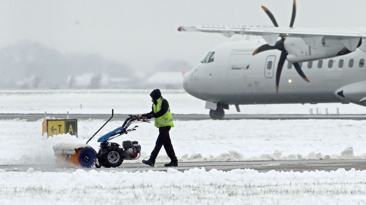 The runway and grounds at Glasgow Airport being cleared
