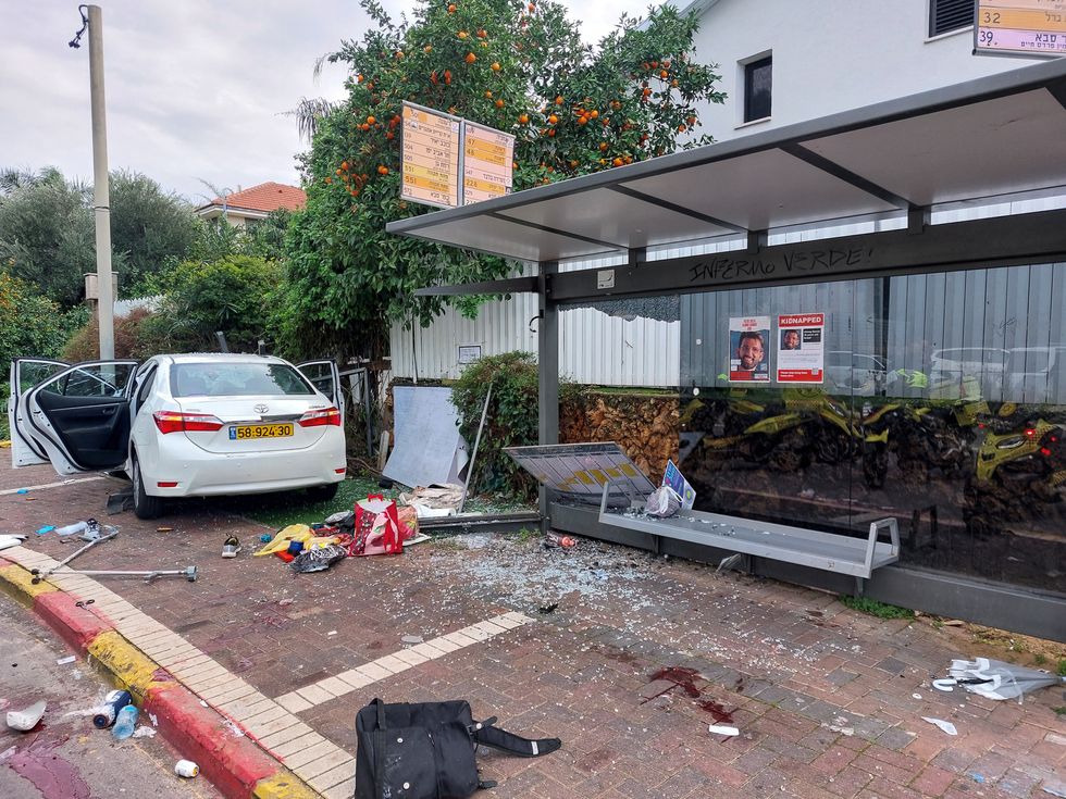 The scene of a damaged car at a bus station following a suspected ramming attack in Raanana, Israel