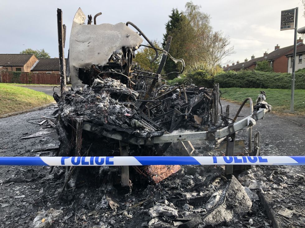 The scene on Abbott Drive in Newtownards near Belfast, after a bus was hijacked and set alight in an attack politicians have linked to loyalist opposition to Brexit's Northern Ireland Protocol.