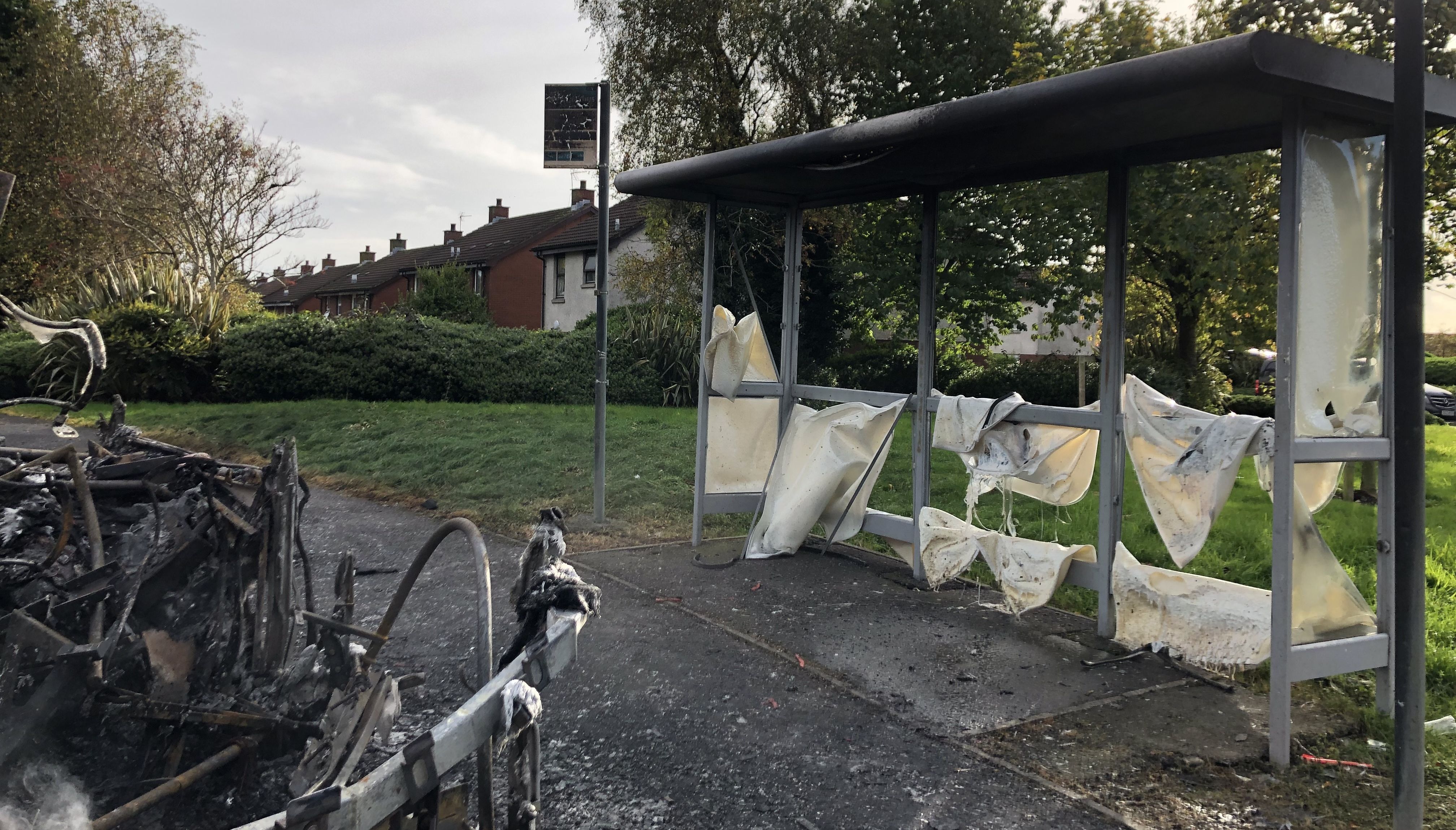 The scene on Abbott Drive in Newtownards near Belfast, after a bus was hijacked and set alight in an attack politicians have linked to loyalist opposition to Brexit's Northern Ireland Protocol.