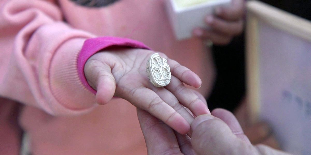 NextImg:Archaeologists in disbelief as toddler discovers 3,800-year-old Egyptian scarab amulet