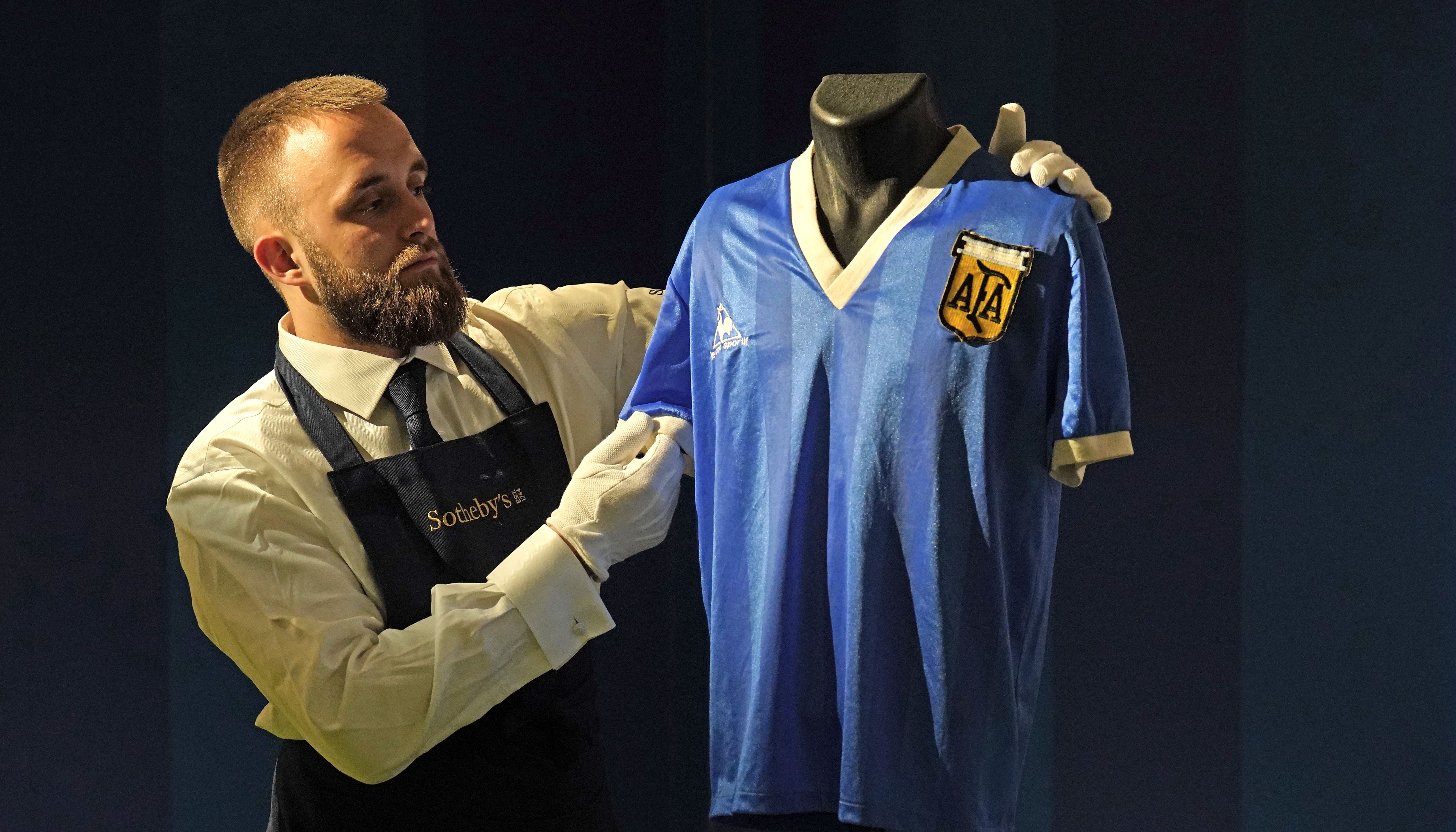 The shirt fetched a world record \u00a37,142,500 at auction