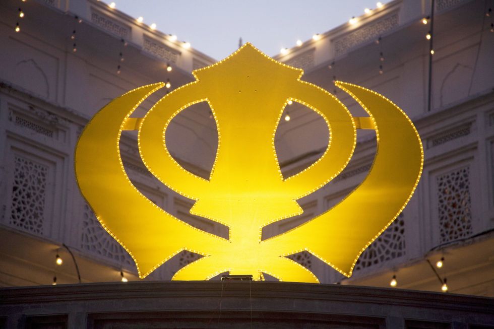 The Sikh symbol in Swarn Mandir Golden temple, Amritsar, Punjab, India