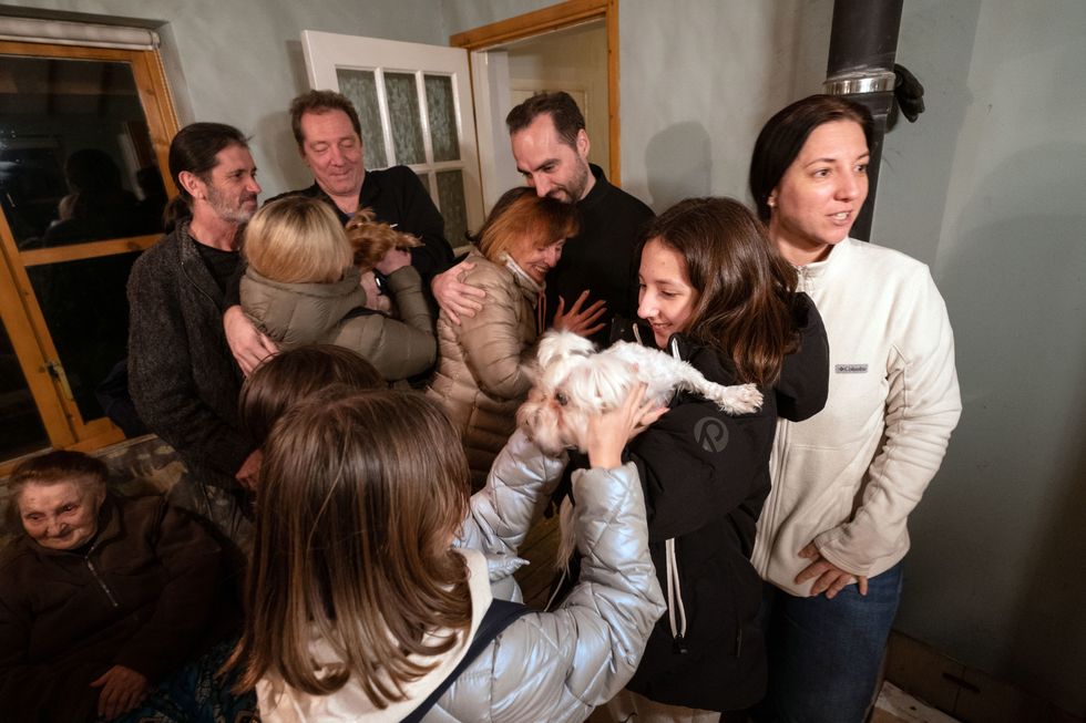 The Starkov family are reunited at their new home in Caldecote near Cambridge. The family of ten who range in age from Alikhan, aged 10, to 90-year-old great grandmother Ludmila, fled Kharkiv in the Ukraine following the Russian invasion, beginning their journeys on March 1. They have been helped by Rend Platings to find a new home in the UK for them and their two dogs Mikki and Florie. Picture date: Tuesday March 22, 2022.