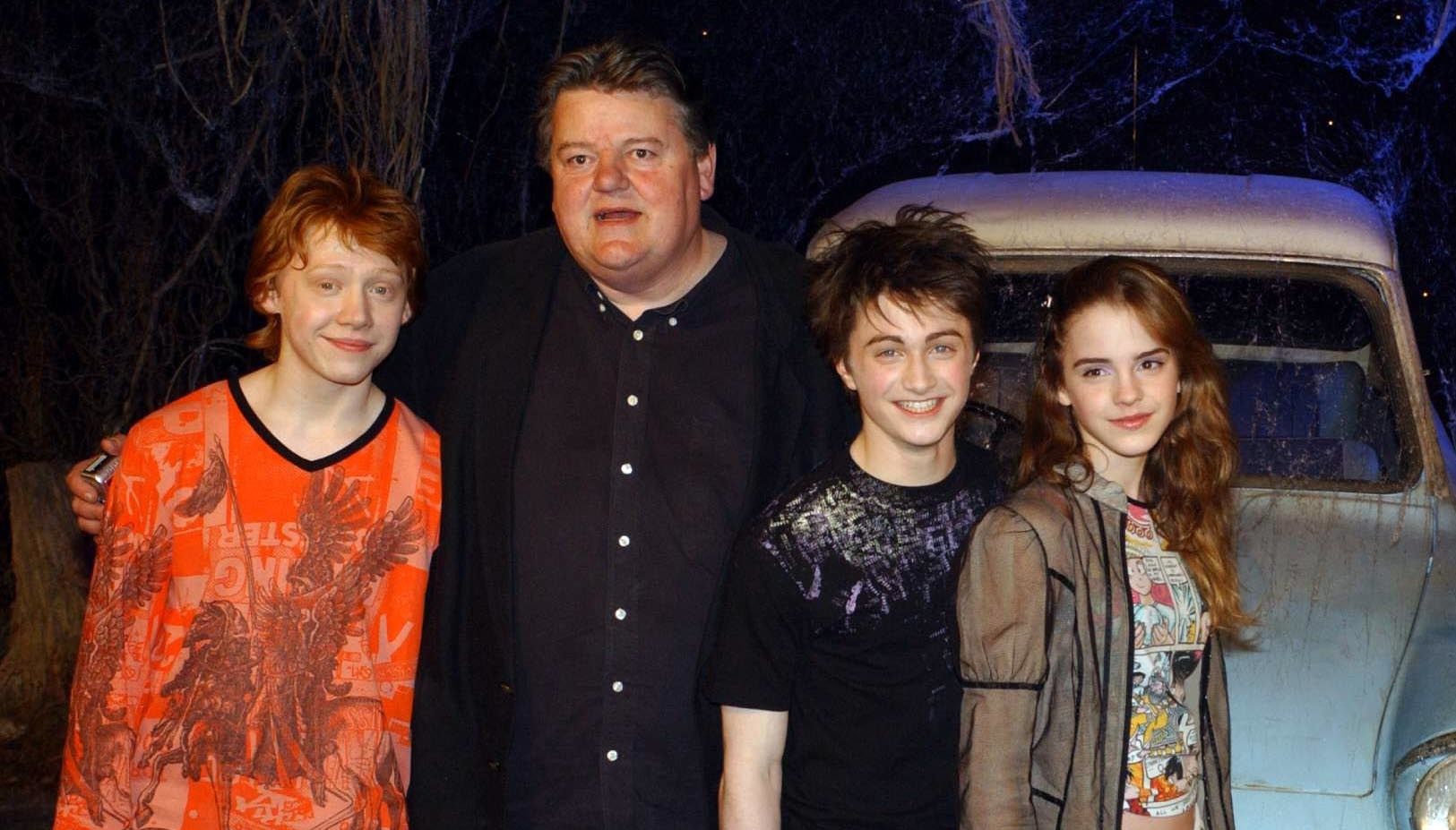 The stars of Harry Potter and the Chamber of Secrets, from left to right; Rupert Grint, Robbie Coltrane, Daniel Radcliffe Emma Watson during the worldwide launch of the DVD/VHS at Leavesden Studios in north London.