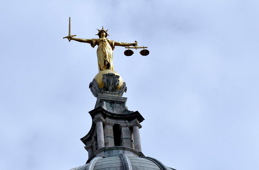 The statue of "Lady Justice" by the British sculptor, Frederick William Pomeroy, which stands on the dome of the Central Criminal Court also referred to as the Old Bailey.